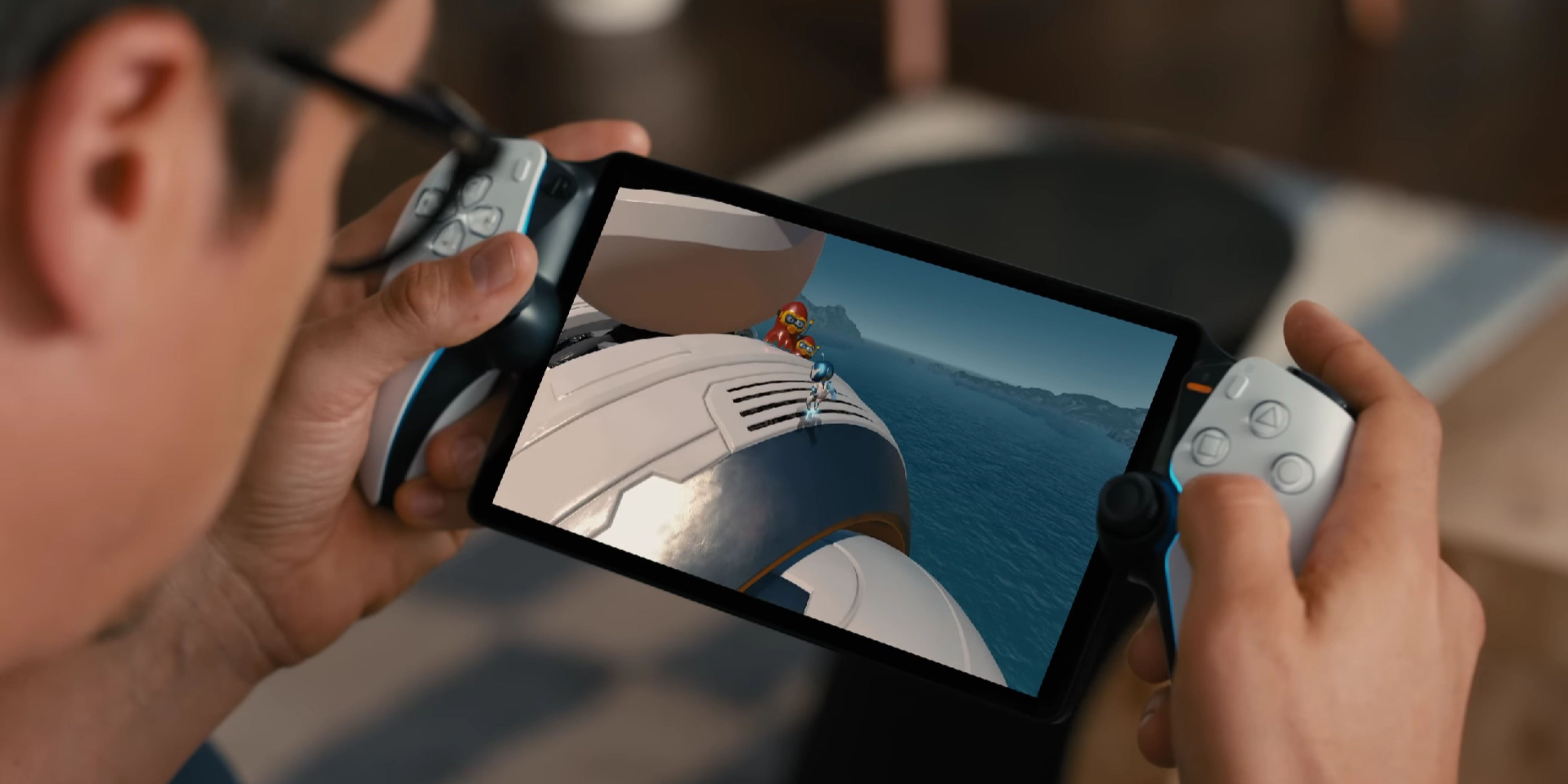 close up of a man playing astro bot on a playstation portal.