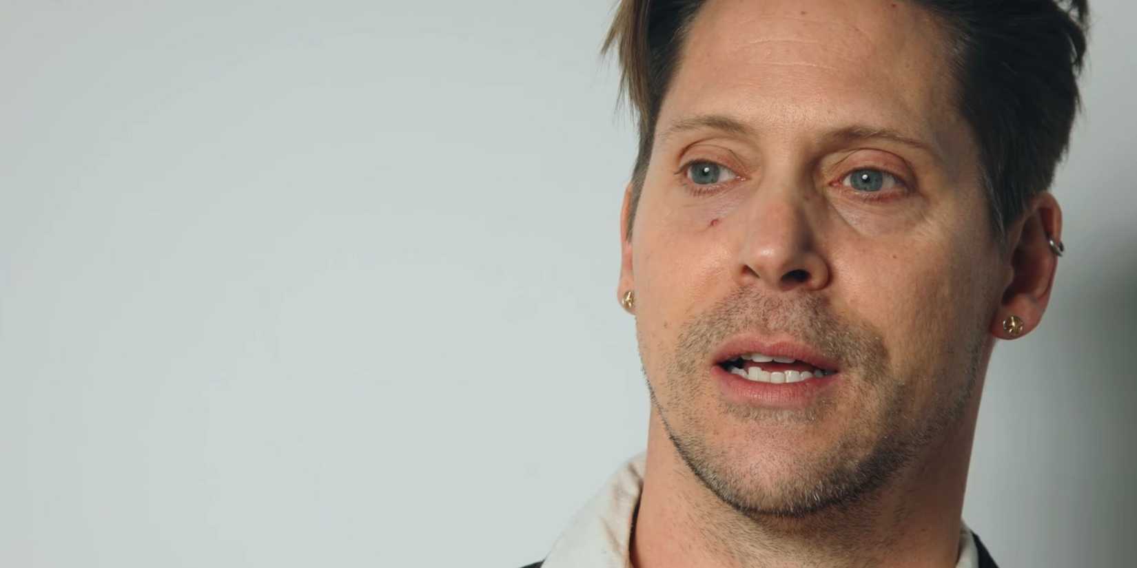 Neil Newbon in the trailer for Dead Take. The shot is a tape of his character's audition, so it's a close-up of his face against a white background.