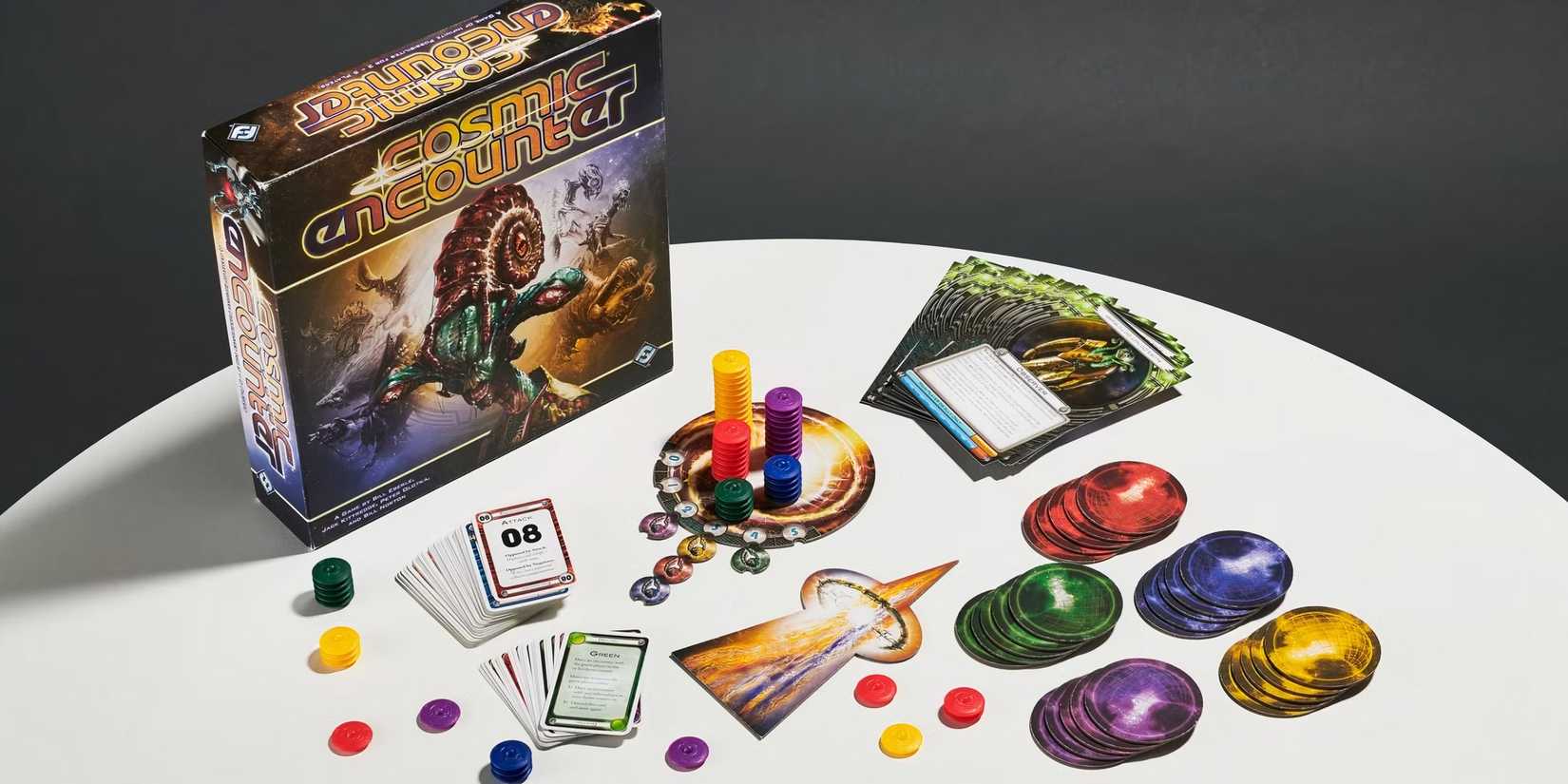 The board pieces and box for the board game Cosmic Encounter.