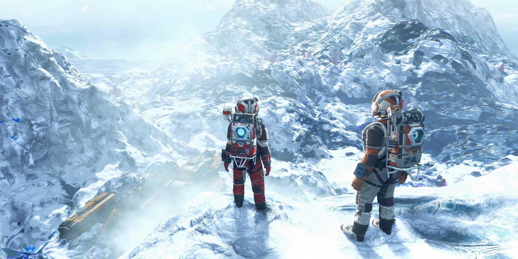 Two No Man's Sky characters standing on a desolate snowy planet dotted with mountains.