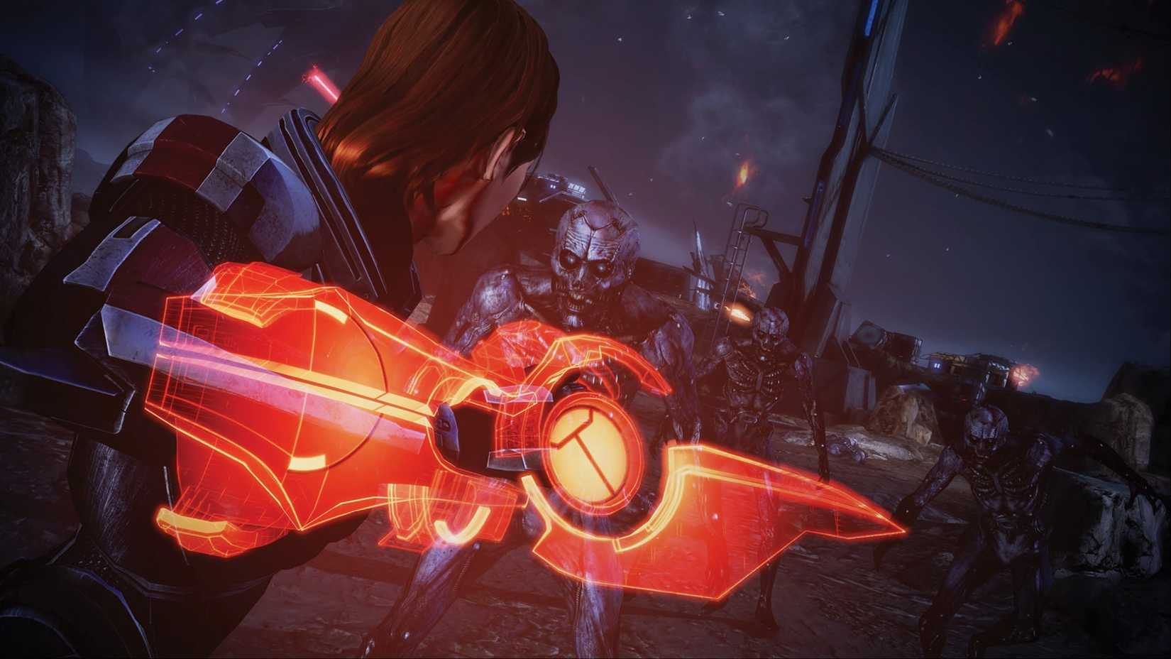 Commander Shepard cocks his arm back and delivers a devastating melee attack to a Husk in Mass Effect: Legendary Edition.