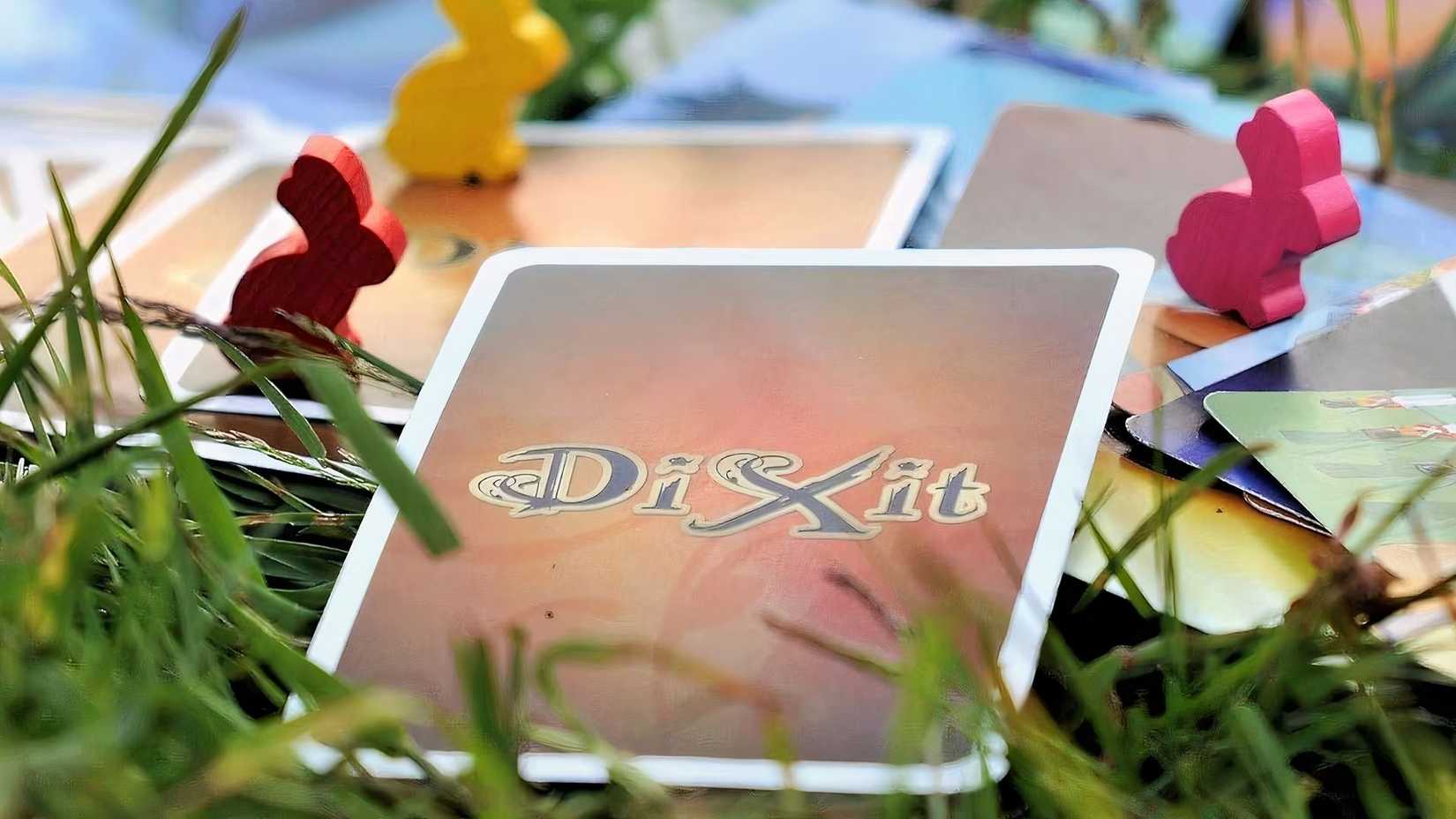 Dick Sit Card lying on the grass.