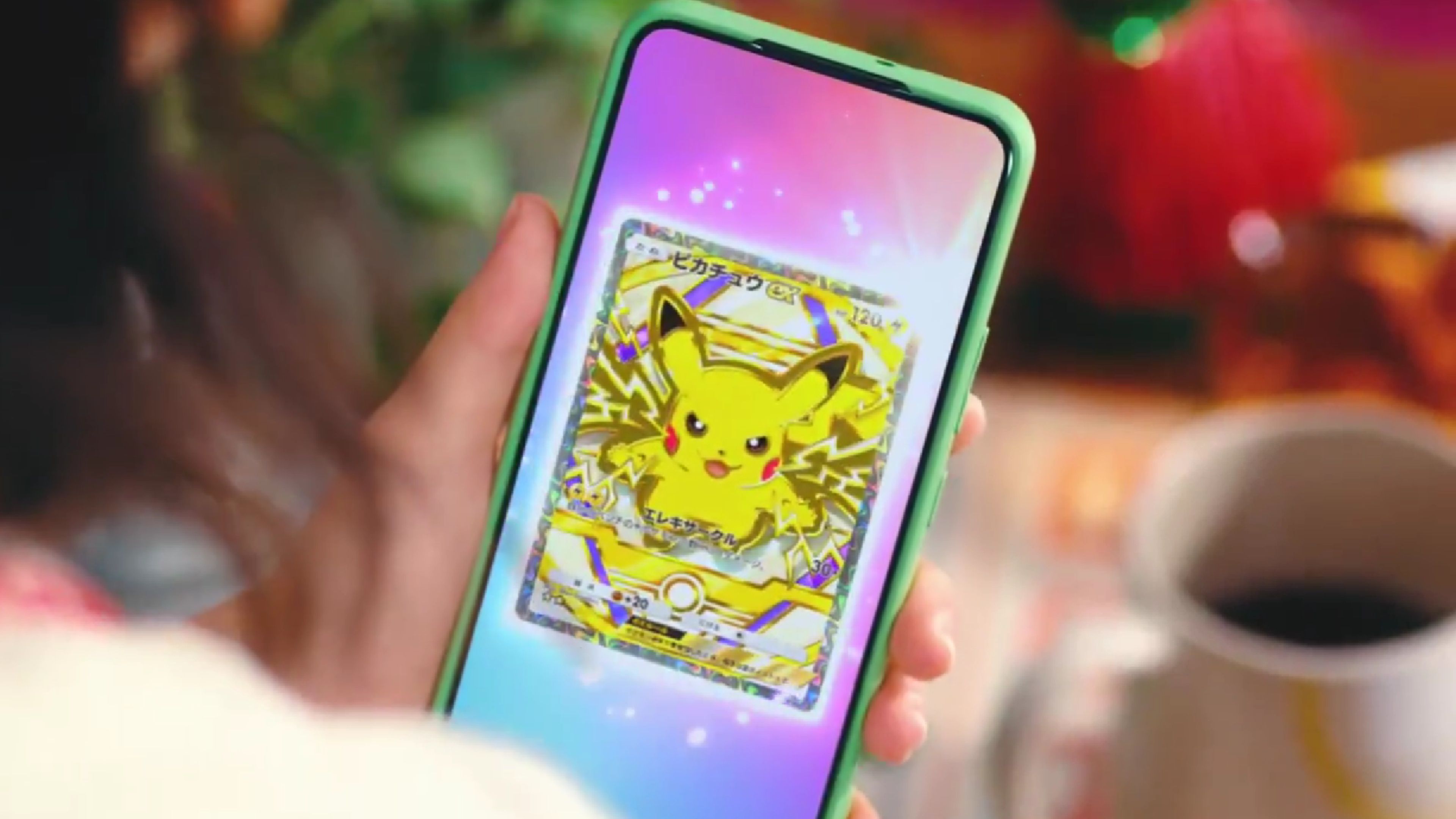 someone looking at a pikachu ex card in pokemon tcg pocket on their phone.