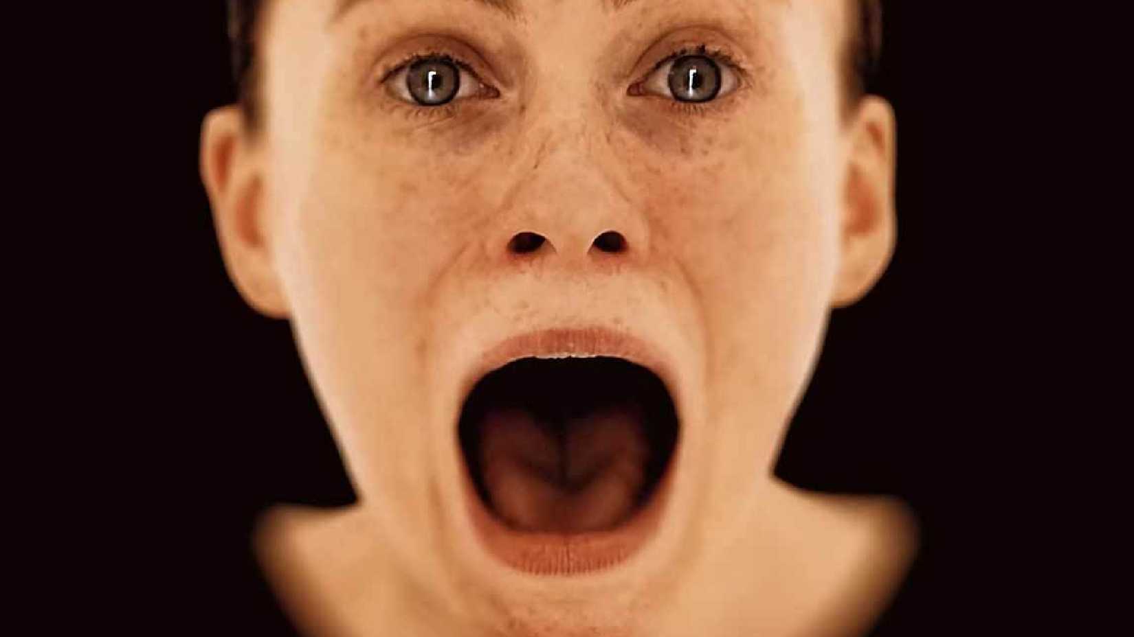 OD teaser of a woman who screams on a brown background.