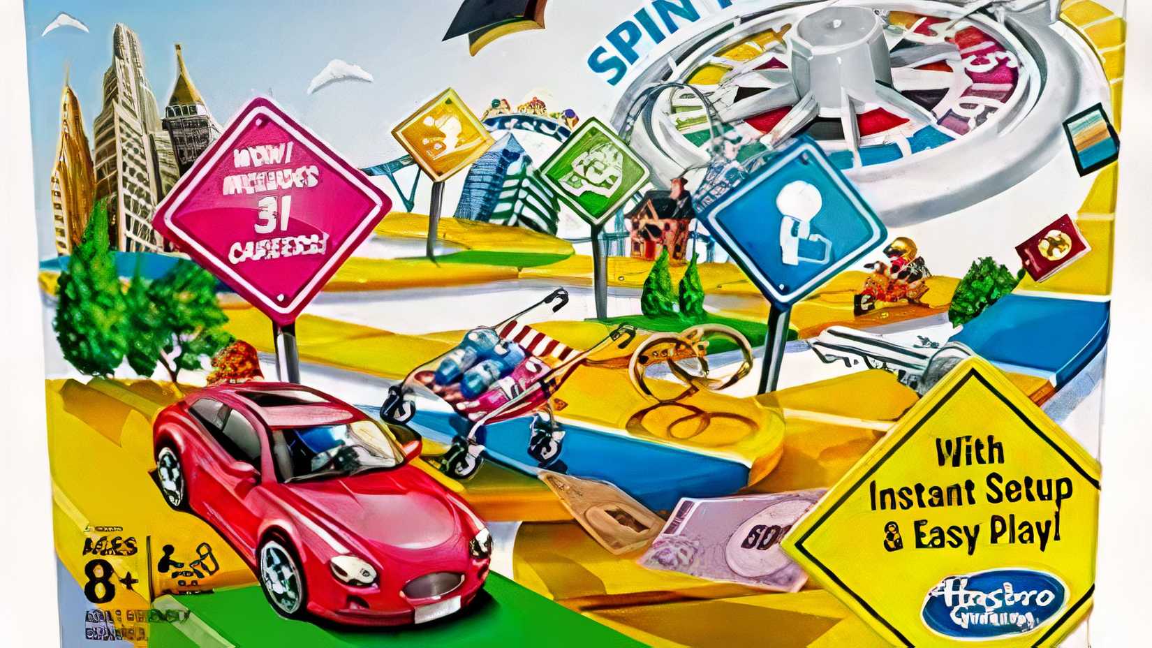 A car driving on the Game of Life board game box.