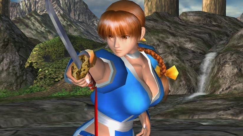 Kasumi is pointing her sword at the screen in Dead or Alive. 