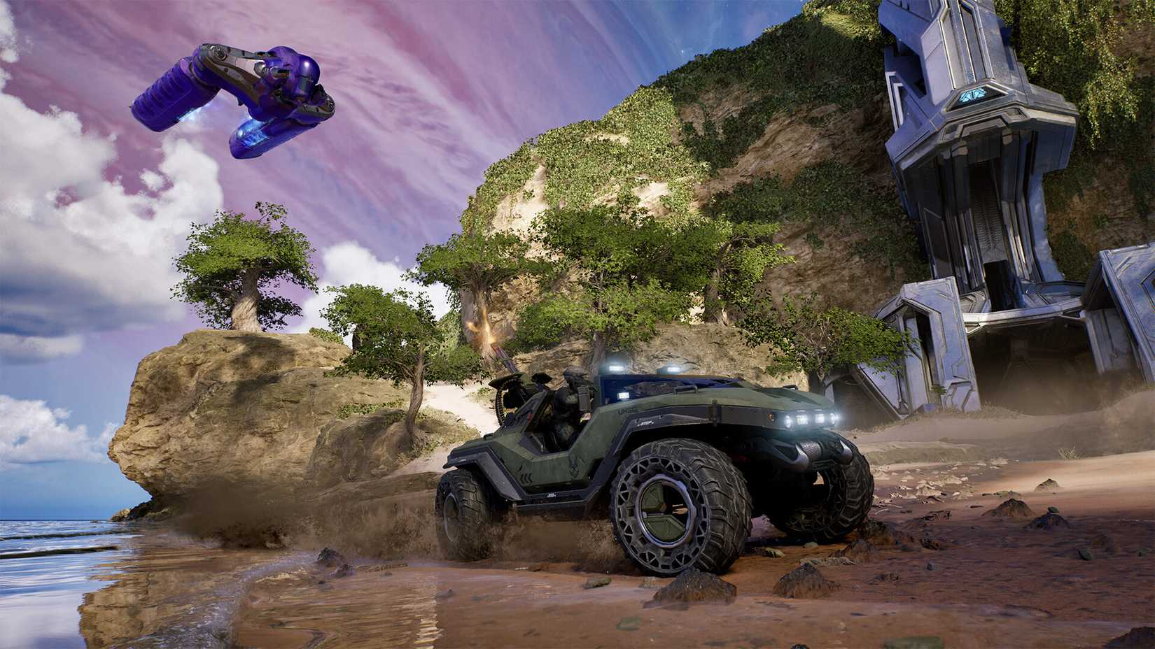 The player drives across a beach in a warthog in Halo: Campaign Evolved.