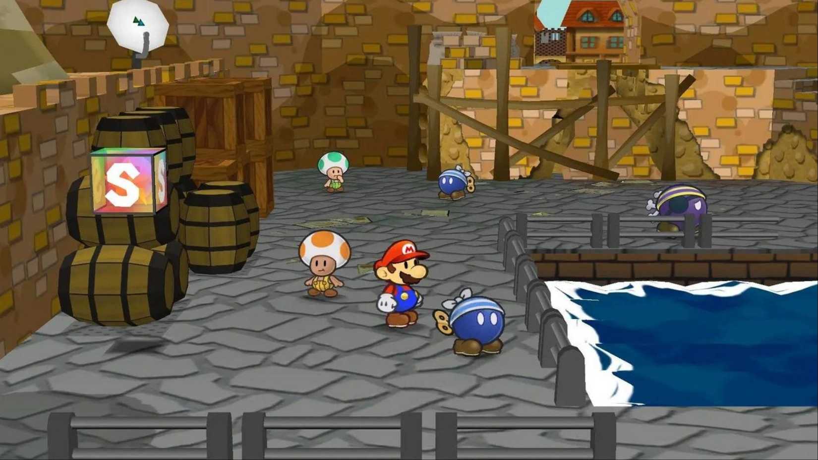 Mario is standing on the dock near Toads and Bob-ombs in Paper Mario: The Thousand-Year Door.