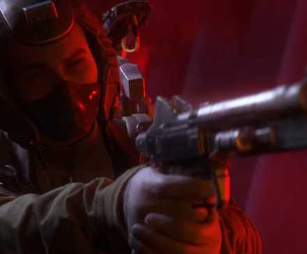A raider from Arc Raiders pointing a gun in red lighting.