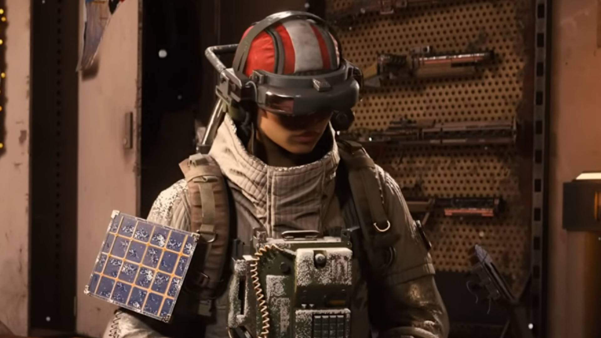 A woman covered in armor sat down on a bed