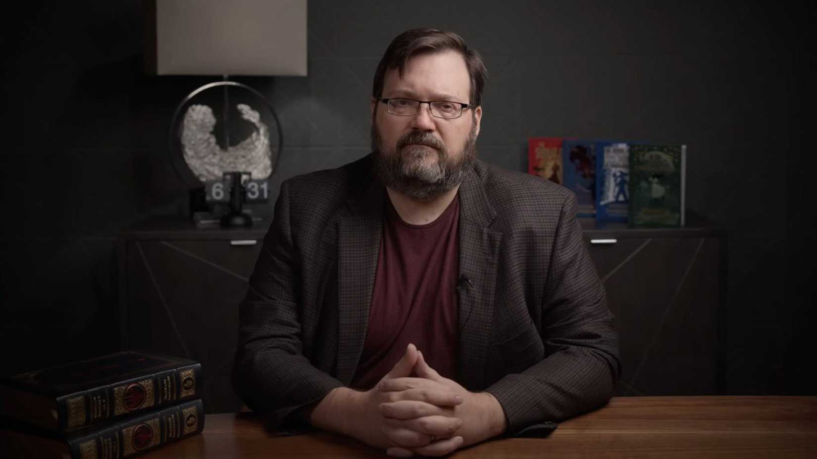 Brandon Sanderson Sitting At Table
