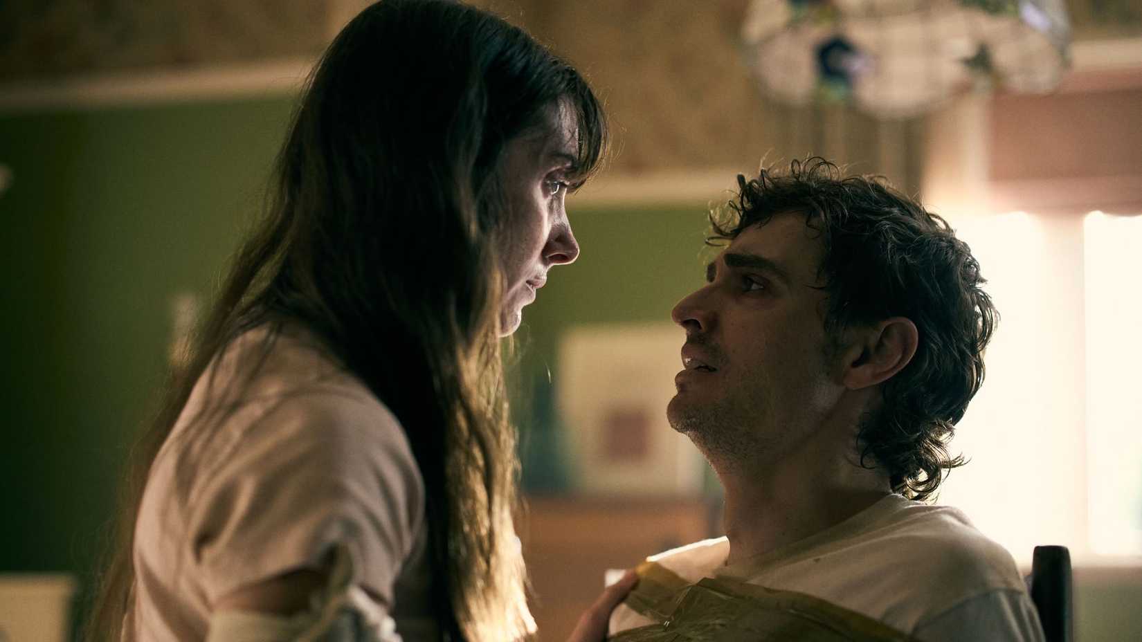 Dave Franco and Allison Brie tied to chairs in Together