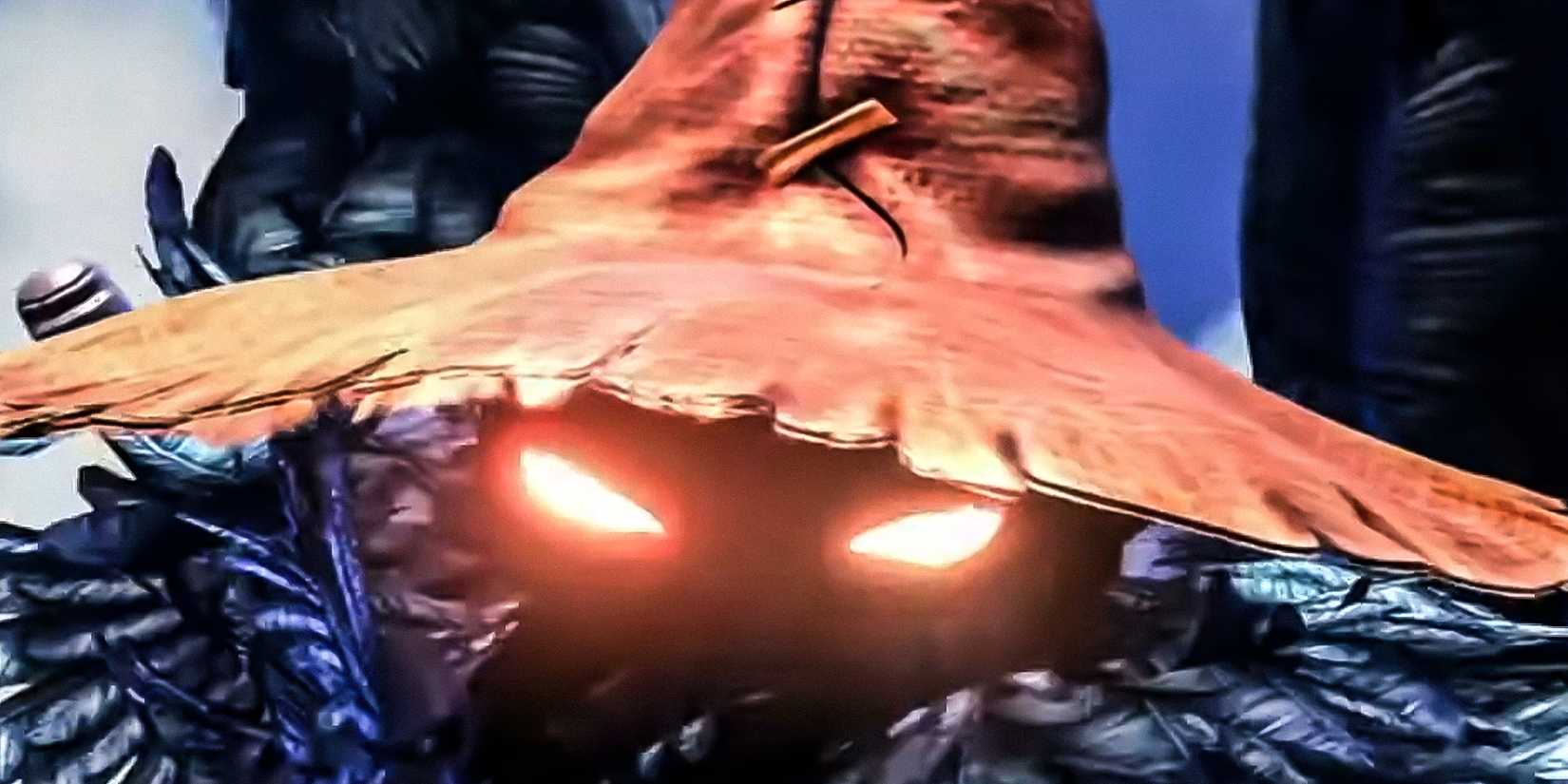 FINAL FANTASY 9 Black Mage peering out from under a giant hat with glowing eyes.