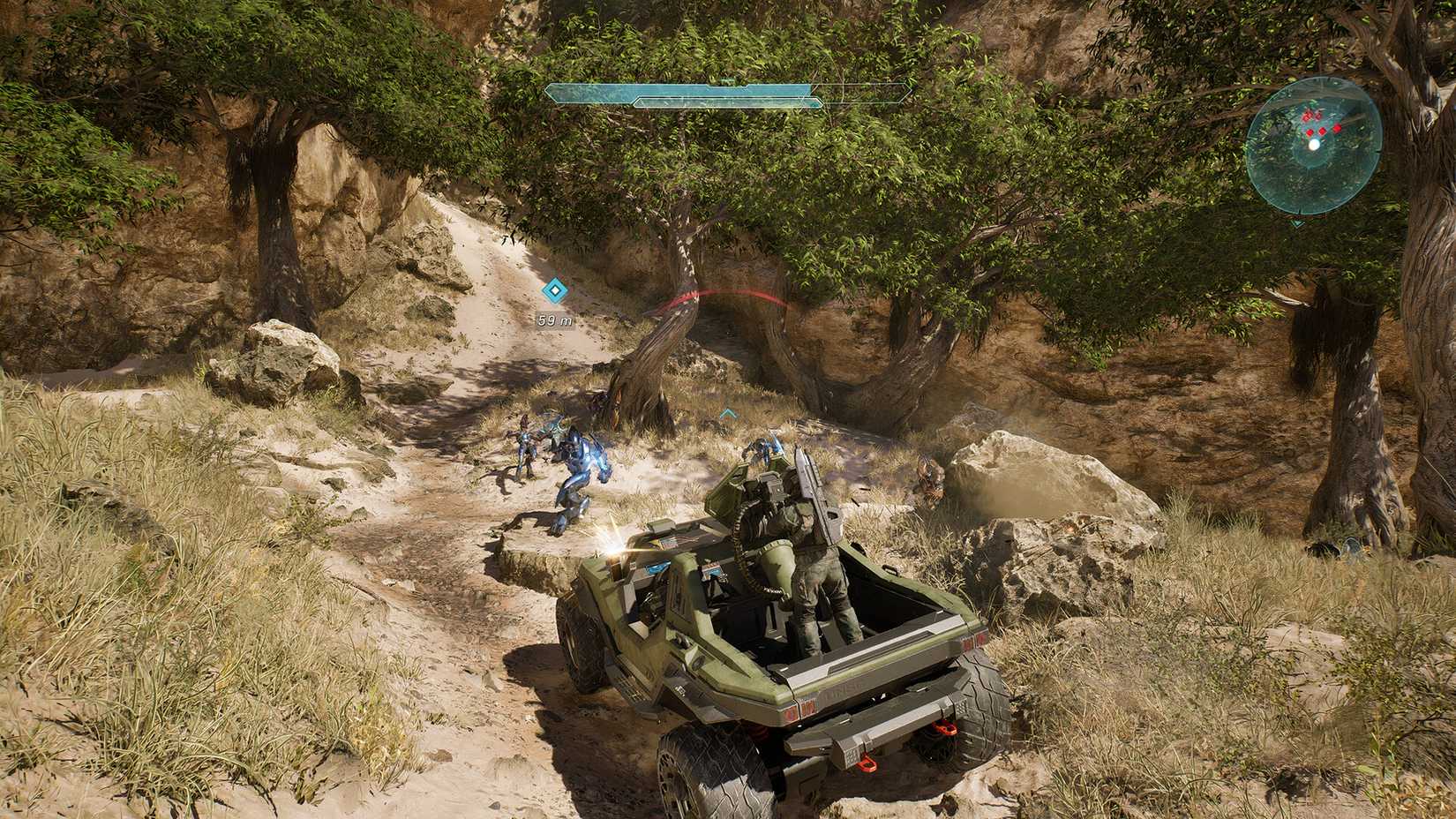 Halo Campaign Evolved troops walking along a path in an open jeep and shooting at enemies.