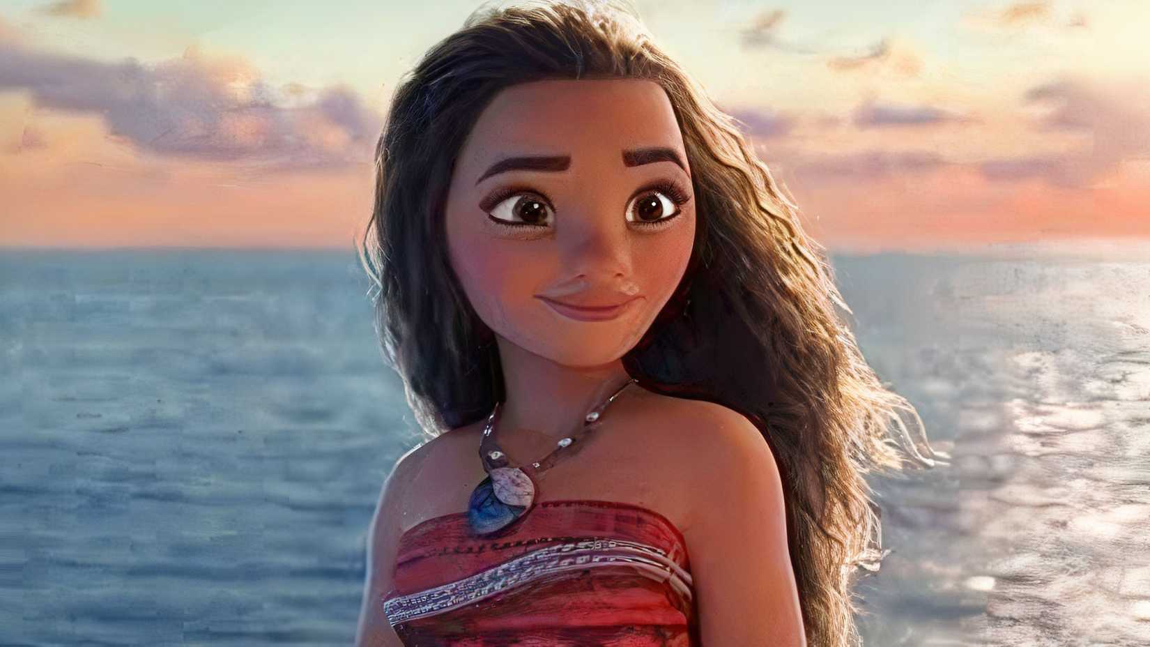 Head and shoulders shot of Moana taken against the ocean at dusk.