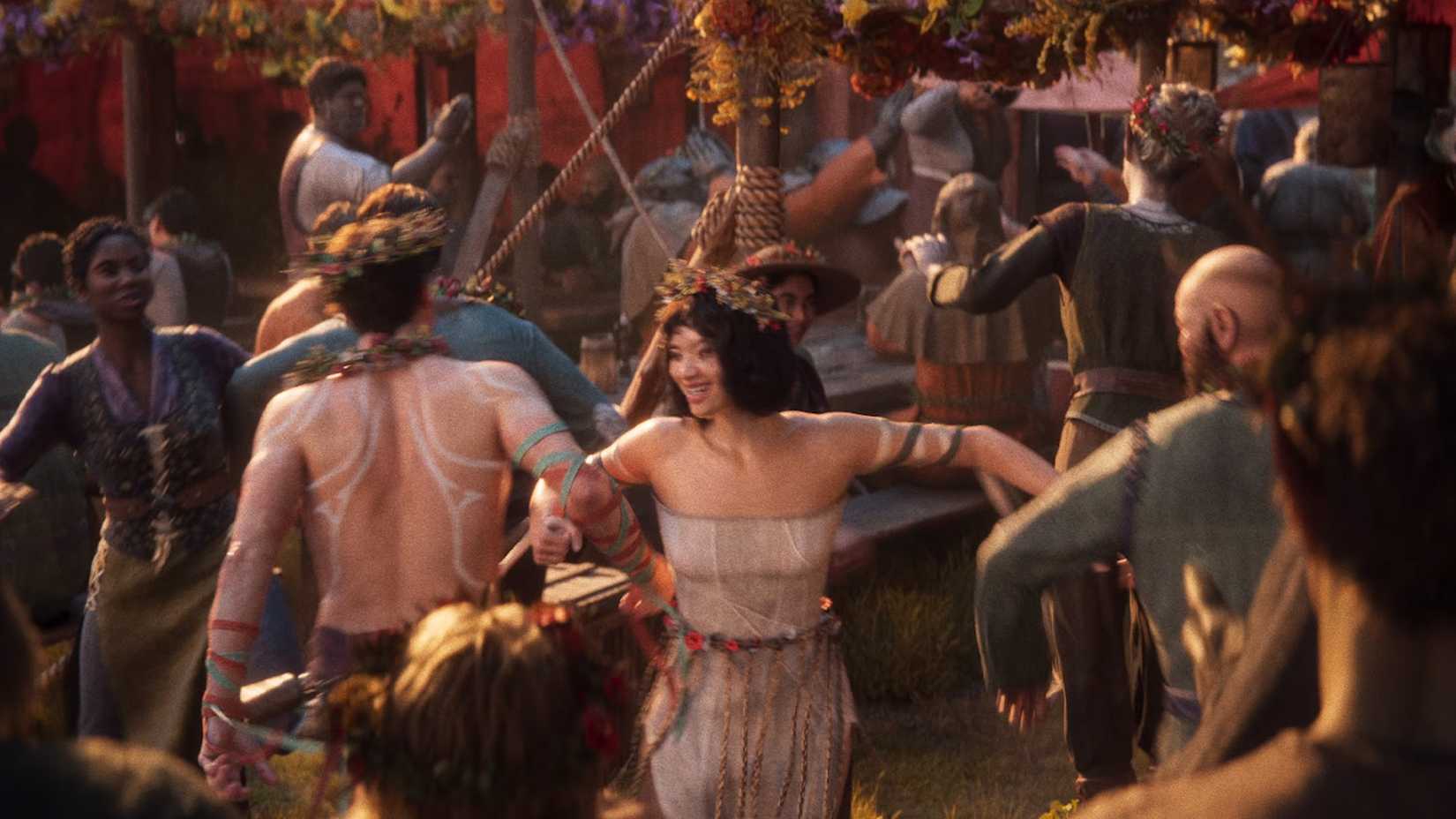 Merry festivalgoers dancing in the Divinity trailer.