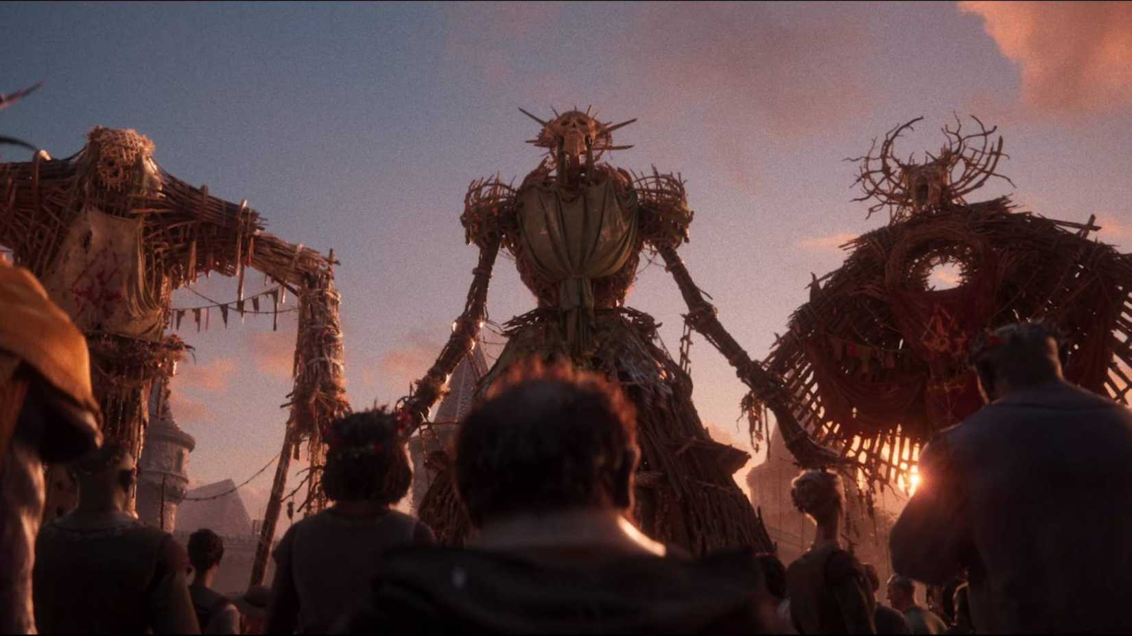 Villagers looking at three giant wooden statues in Divinity.