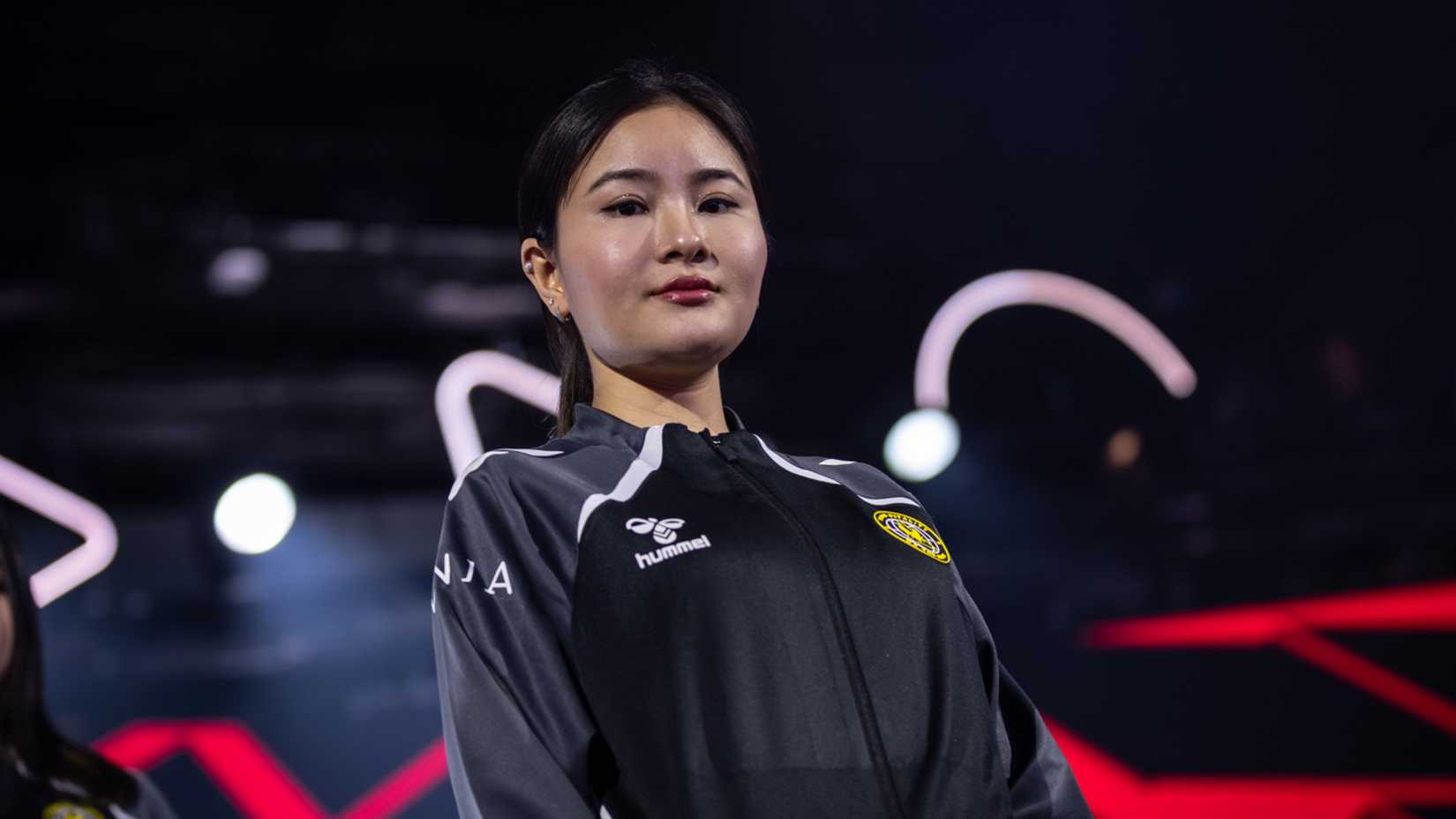 Vivian looks down on camera Esports World Cup