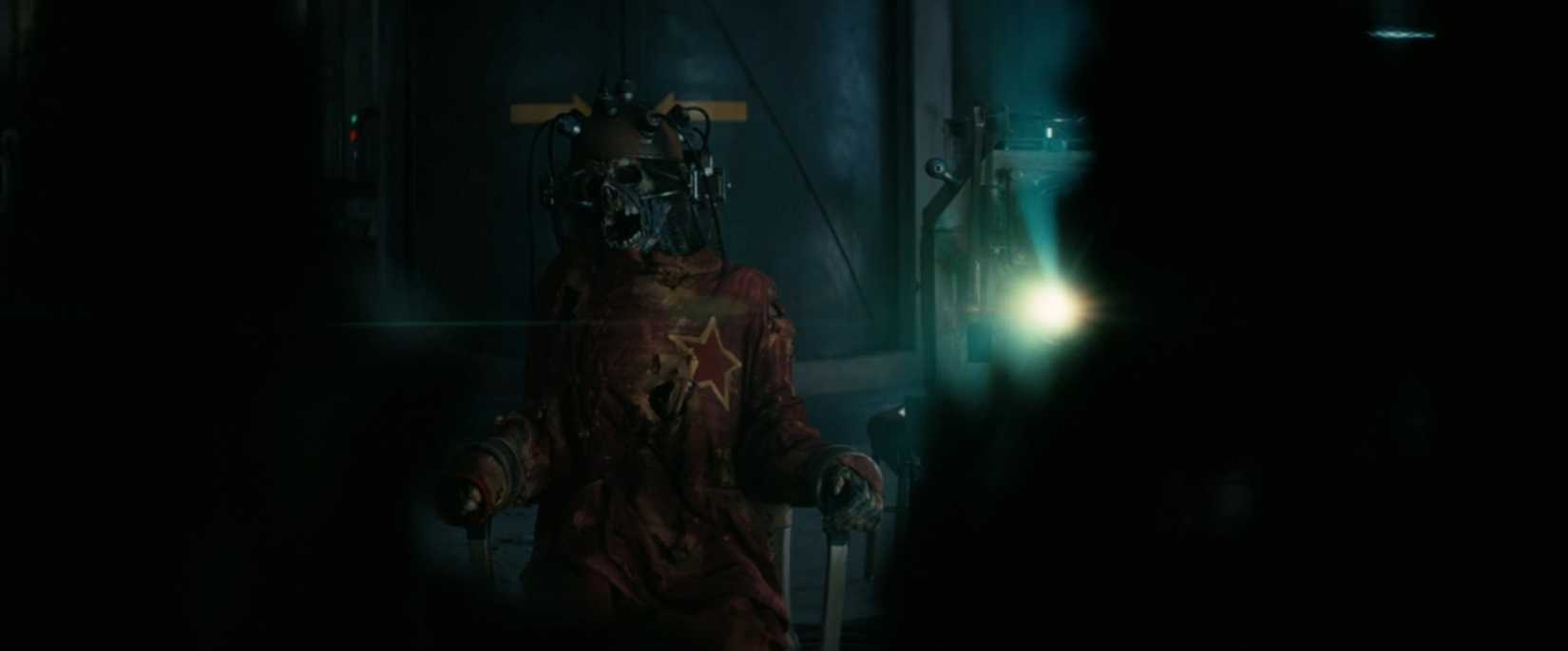 Skeleton in a communist outfit connected to a machine.