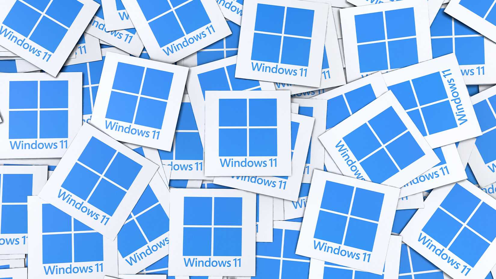 Dozens of Windows 11 squares stacked on top of each other.