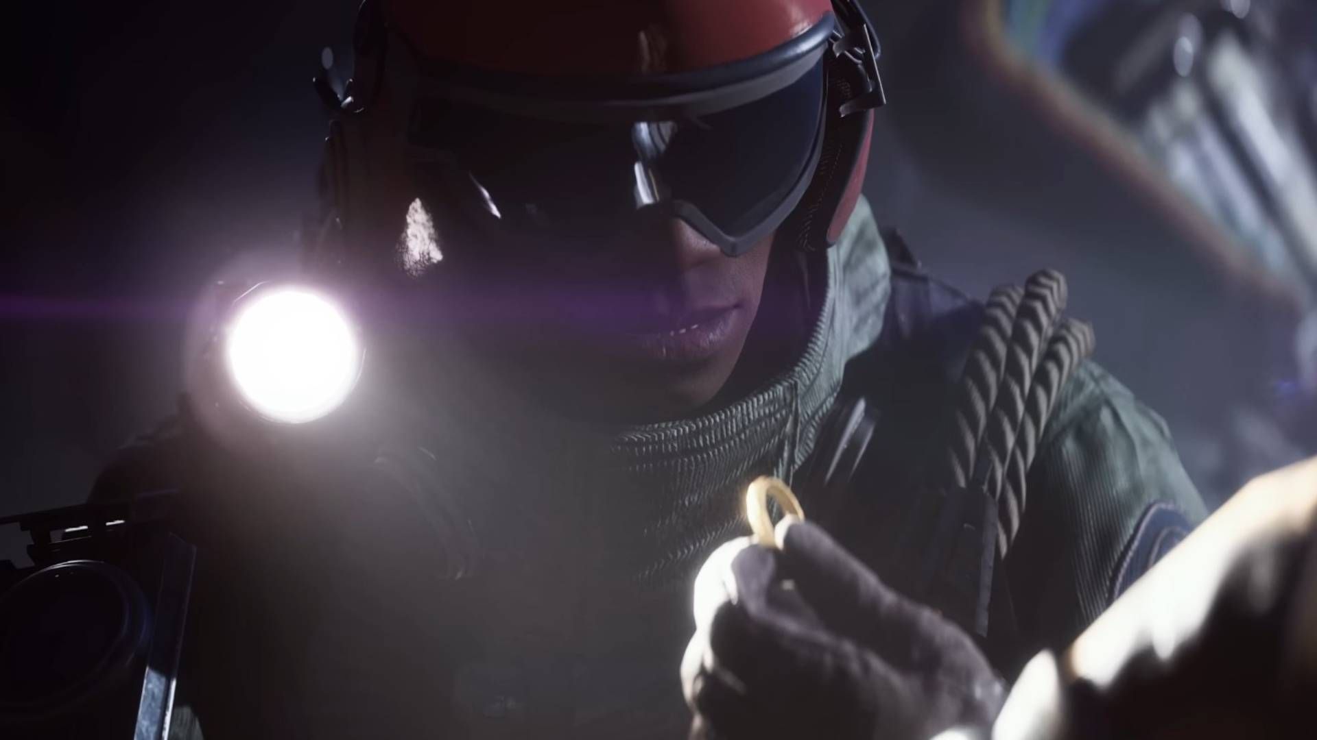 A raider examining a ring with a flashlight in Arc Raiders.