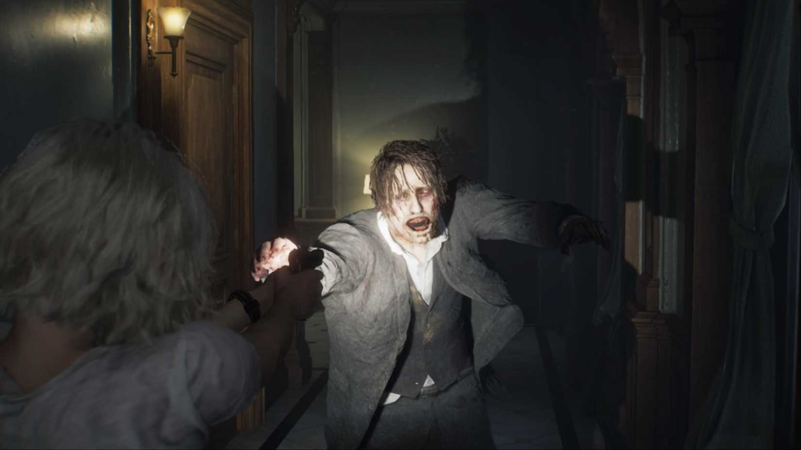 Grace Ashcroft points her gun at an infected zombie inside the Rhodes Hill Care Center in Resident Evil Requiem.