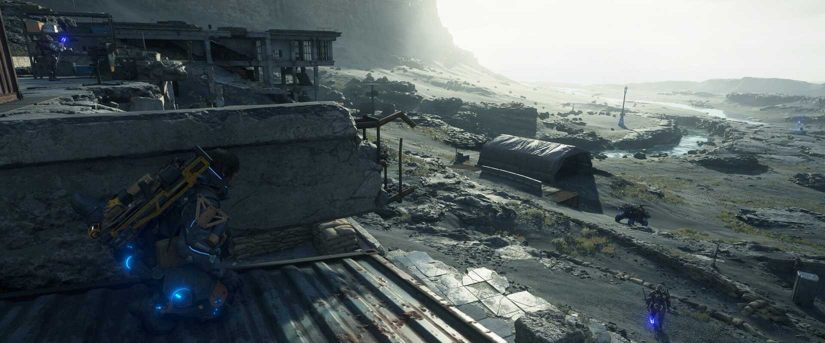 Sam Porter Bridges hides behind cover in Death Stranding 2. 