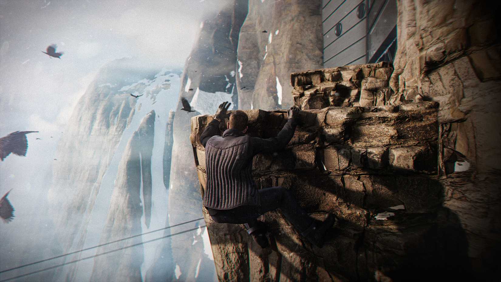 James Bond hangs on a snowy ledge in 007: First Light. 