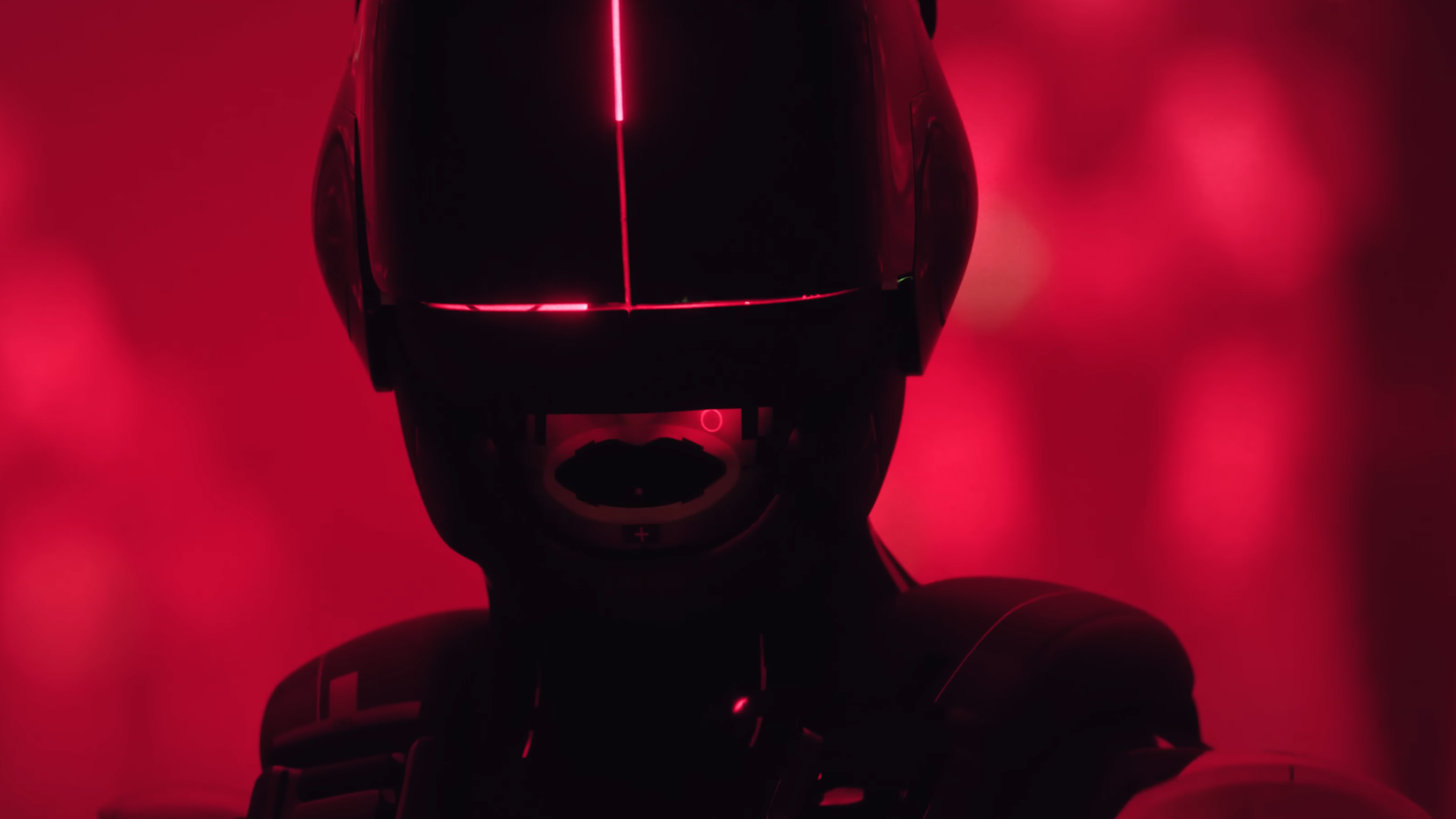 a black masked marathon character against a neon red backdrop.