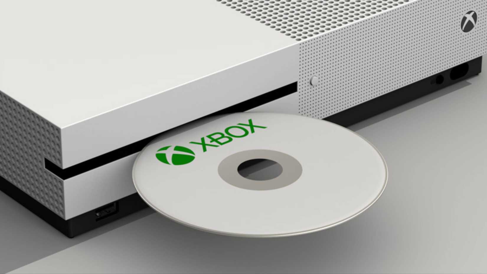 xbox disc being inserted into an xbox one.
