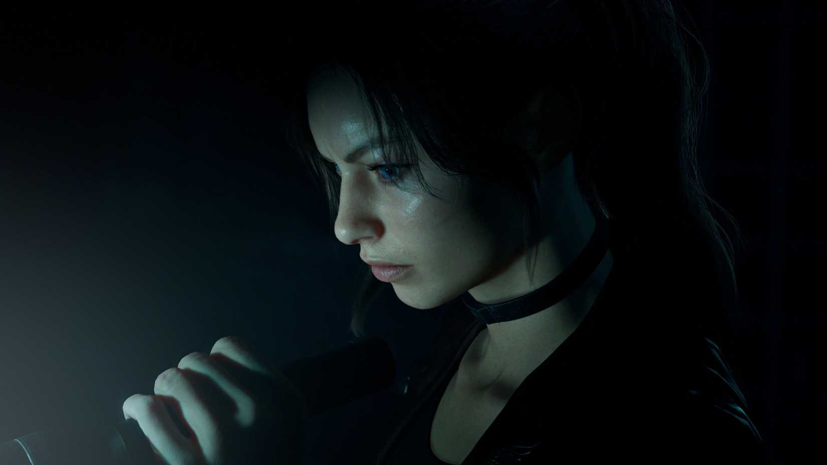 Claire Redfield holds a torch in Veronica.