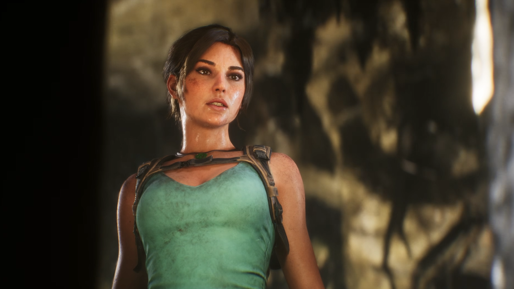 Lara Croft standing and look sweaty in the Tomb Raider Legacy of Atlantis trailer.