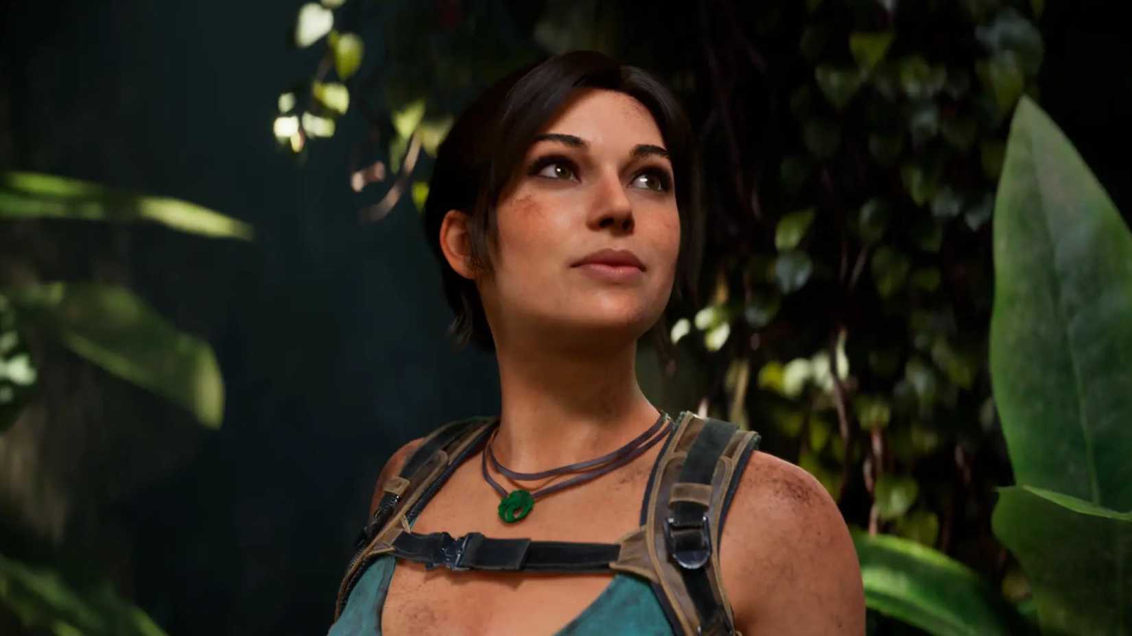 Lara Croft walks through a jungle and looks up, as seen in Tomb Raider Legacy of Atlantis.
