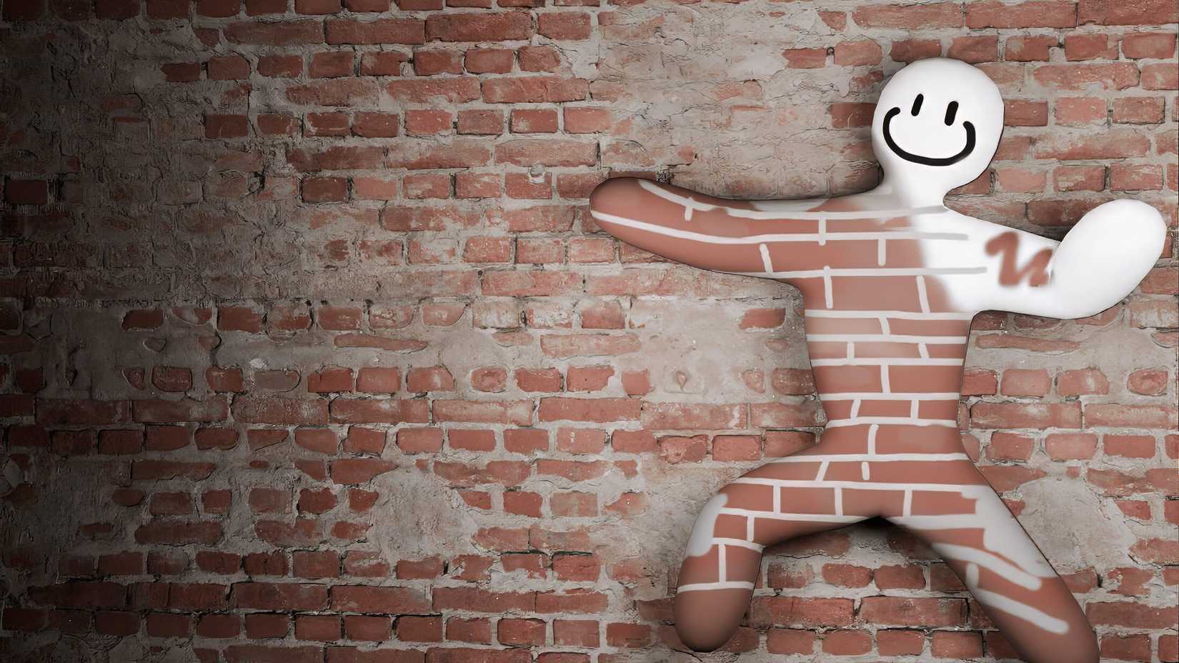 Mecha Chameleon player hiding in a brick wall. It's only half painted to match.