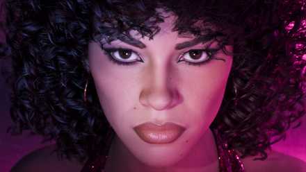 A close-up of Lucia wearing the Vice City Pack gear from GTA 6.