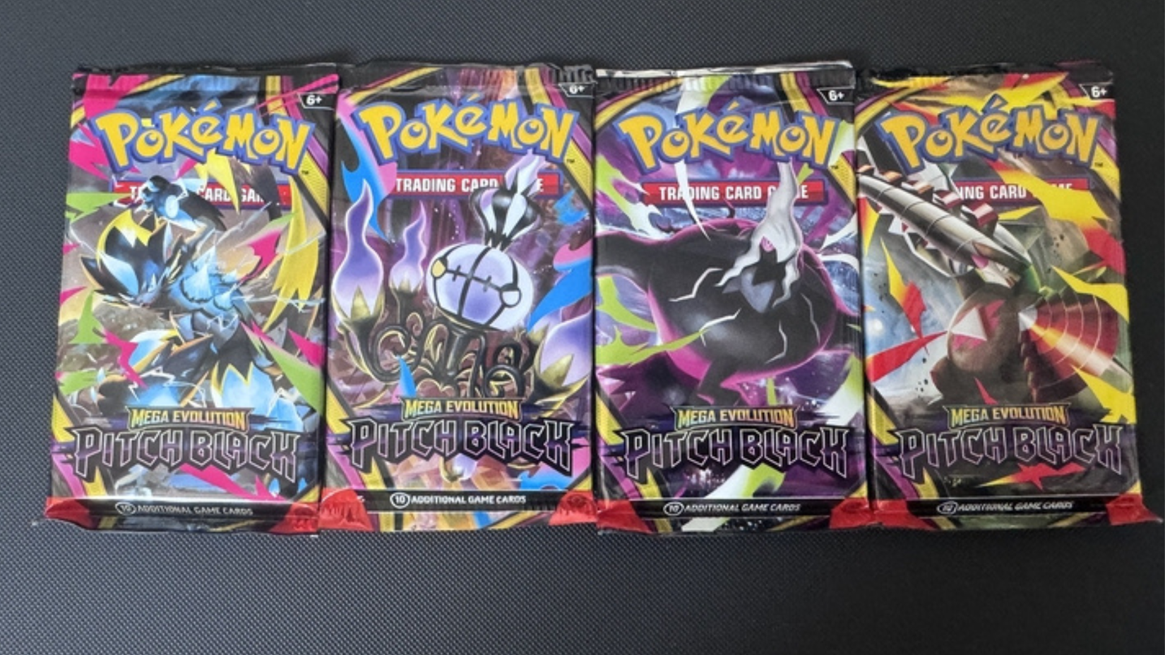 A photo of a selection of pokemon tcg pitch black pack art.