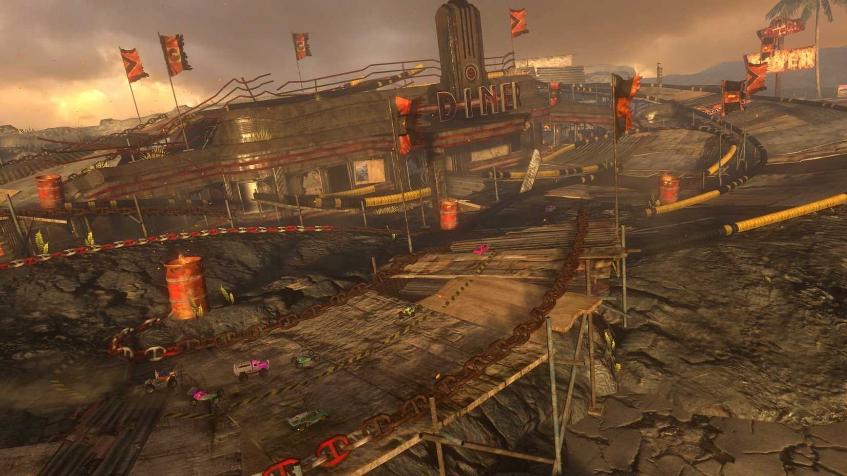 A bunch of cars racing around a track in Motorstorm RC.