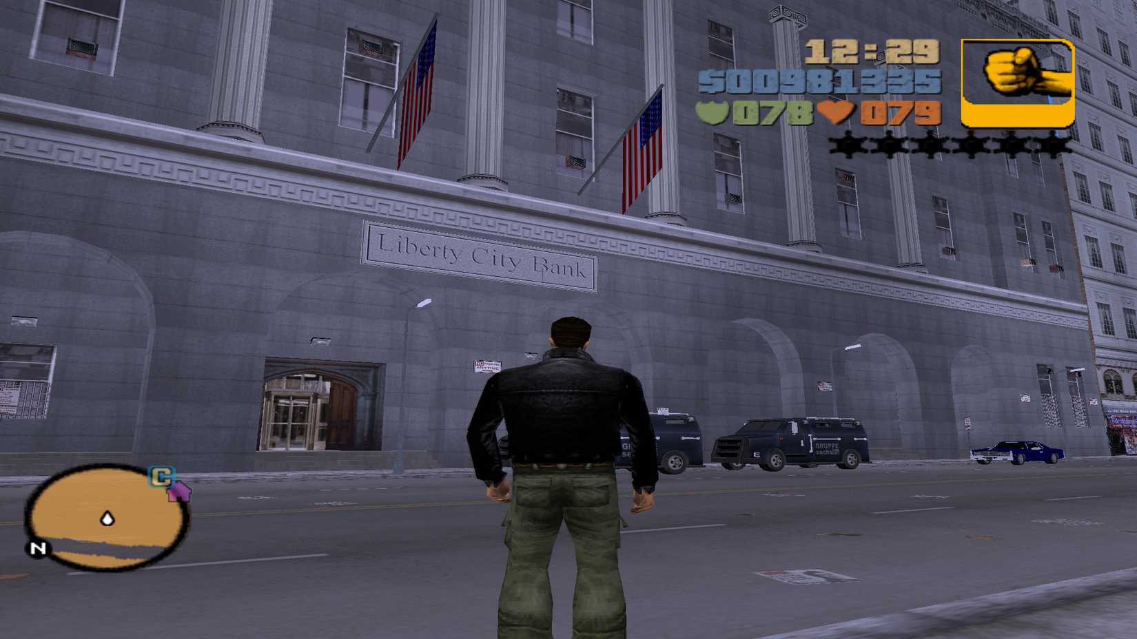 Claude in GTA 3 is standing outside the Liberty City Bank.