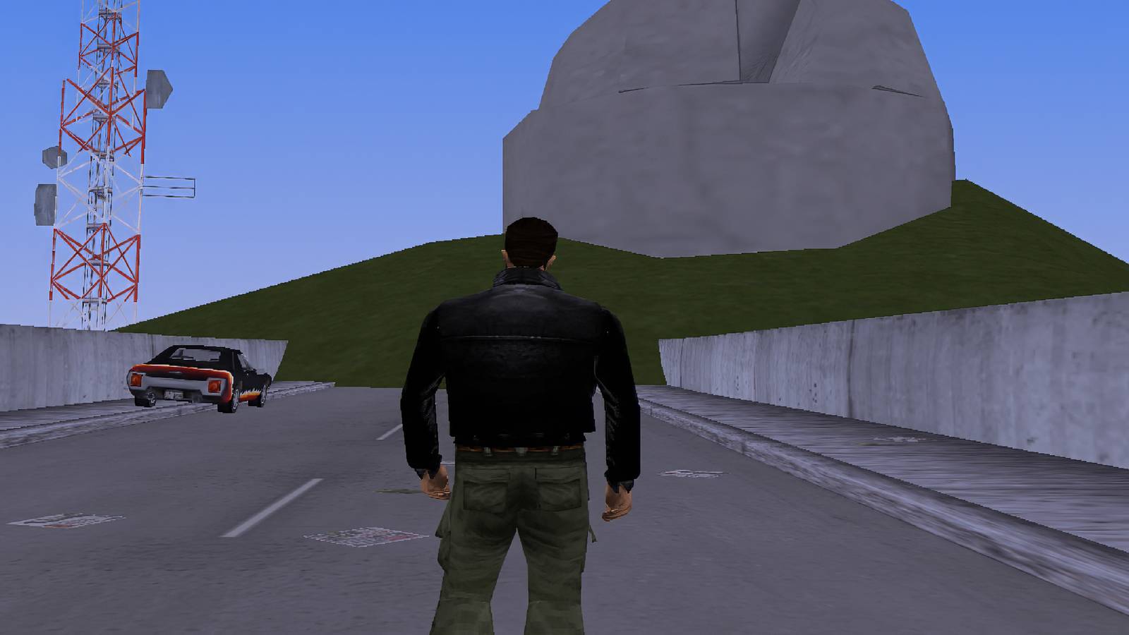 Claude standing on an out of bounds road in GTA 3.