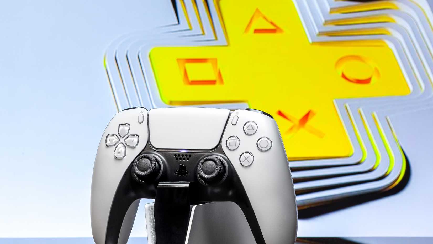 DualSense in front of PS Plus logo.