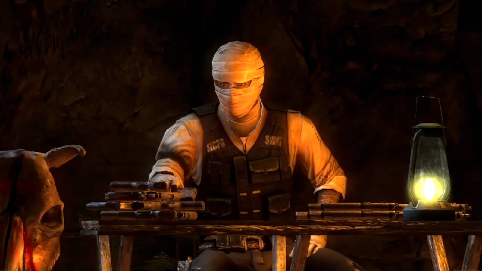 Joshua Graham in Fallout New Vegas. He is wrapped in bandages from his burn scars and is reloading pistols. 
