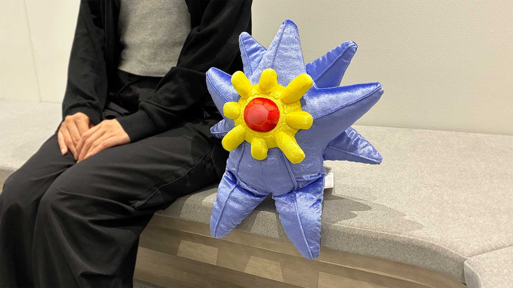mega starmie plush sitting down.