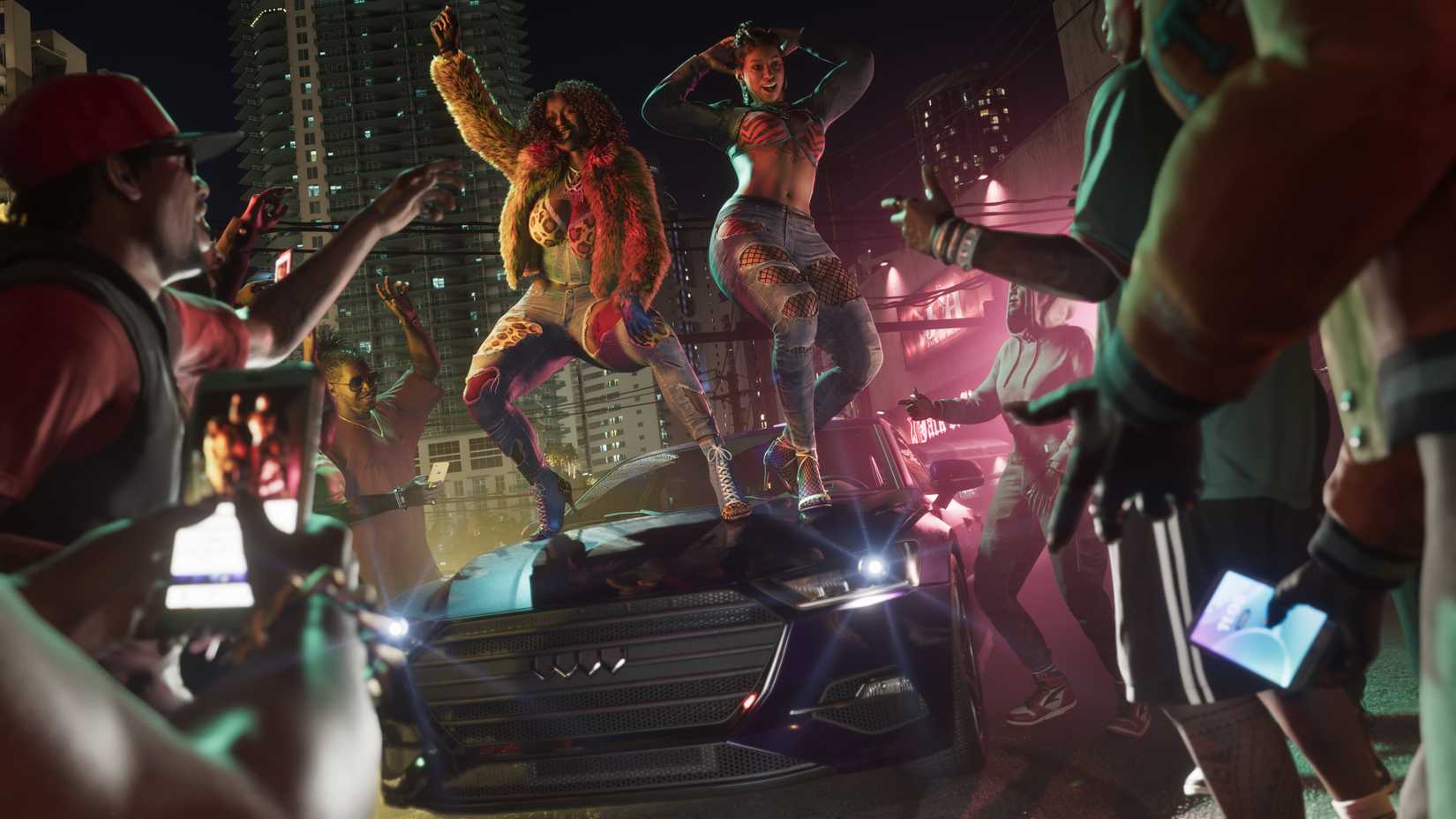 Crowd watching two women dance on the hood of a car in Grand Theft Auto 6.