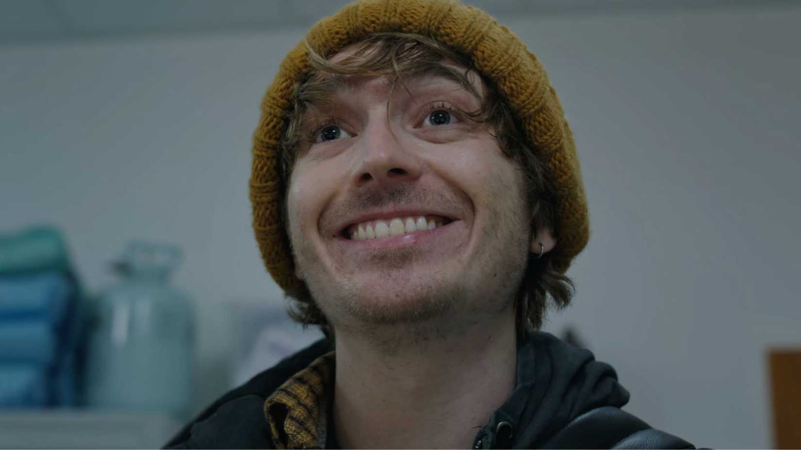 Resident Evil movie's protagonist doing a big cheesy grin.