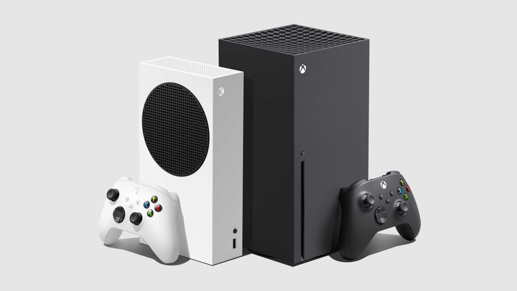 xbox series x and series s with controllers standing alongside each other.