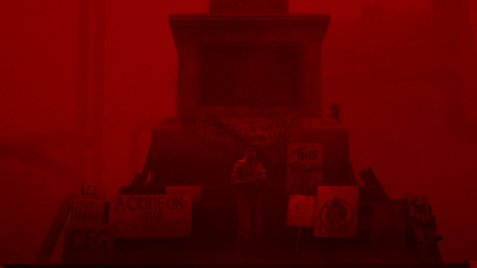 silent hill protag set to a red hue backdrop in a town center.