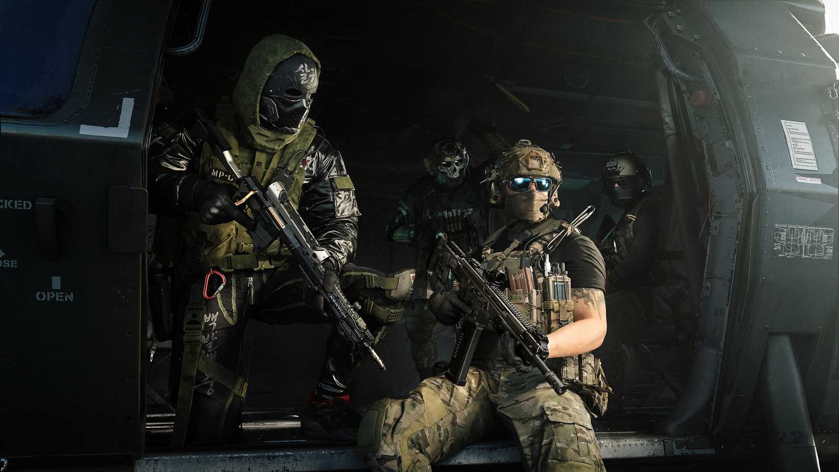 Call of Duty Modern Warfare 4 players stepping out of a helicopter, armed with assault rifles.