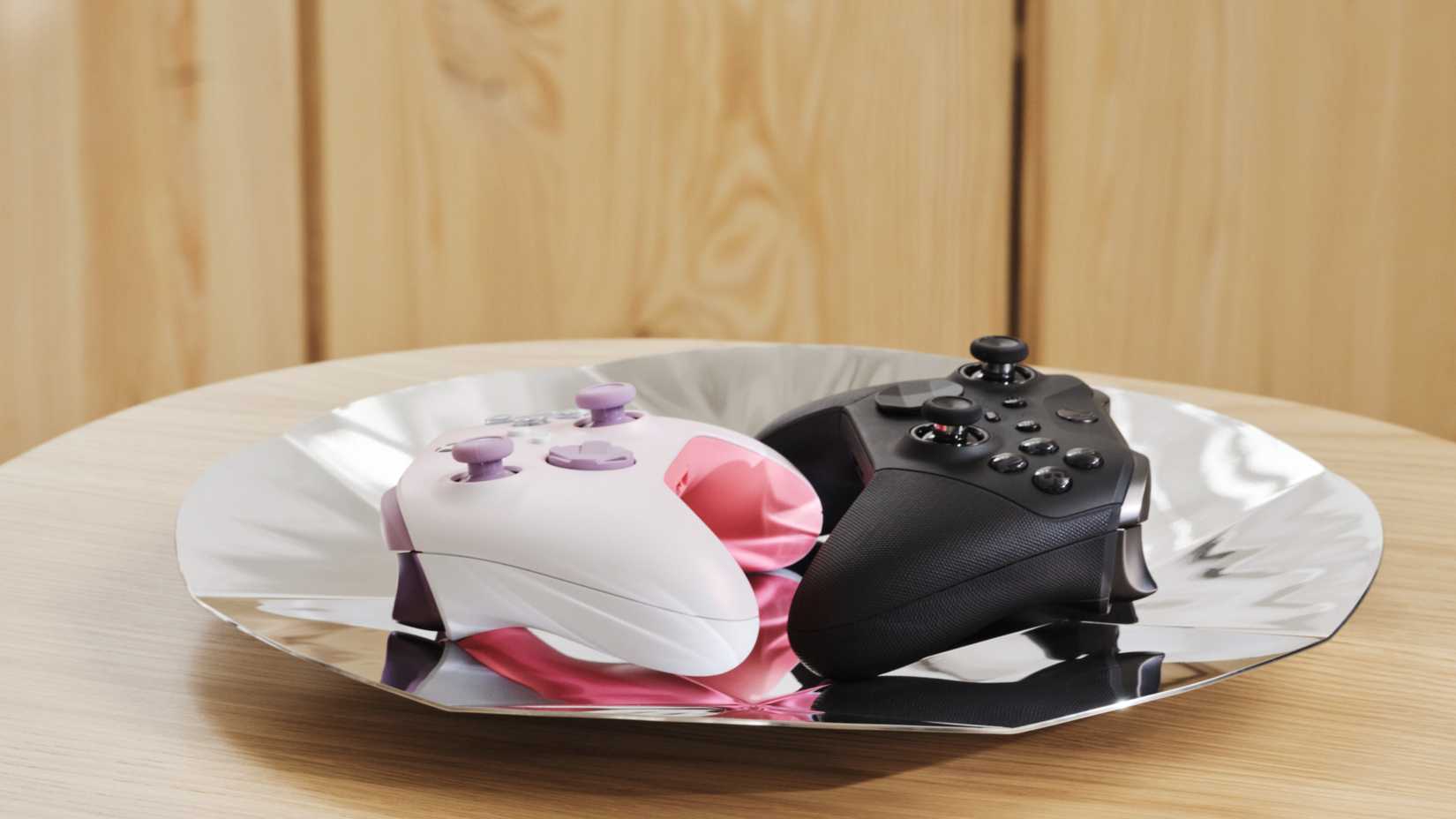 xbox controllers on a silver d-pad platter.