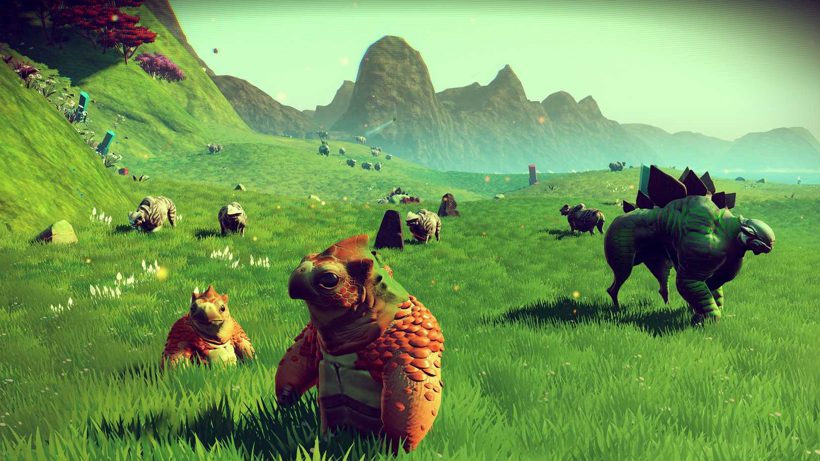 A variety of wild animals on a green planet in No Man's Sky. 