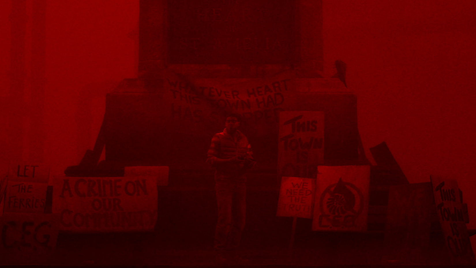 simon from silent hill in front of a monument.